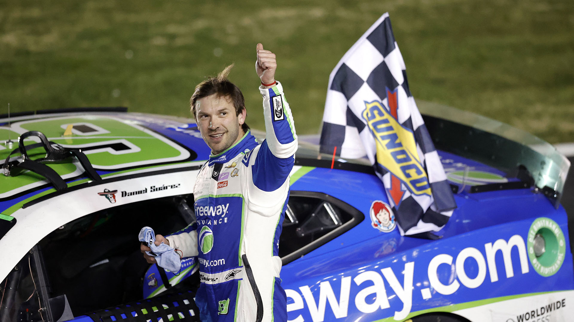 HAMPTON, GEORGIA - FEBRUARY 25: Daniel Suarez, driver of the #99 Freeway Insurance Chevrolet, celebrates after winning the NASCAR Cup Series Ambetter Health 400 at Atlanta Motor Speedway on February 25, 2024 in Hampton, Georgia.   Alex Slitz/Getty Images/AFP (Photo by Alex Slitz / GETTY IMAGES NORTH AMERICA / Getty Images via AFP)